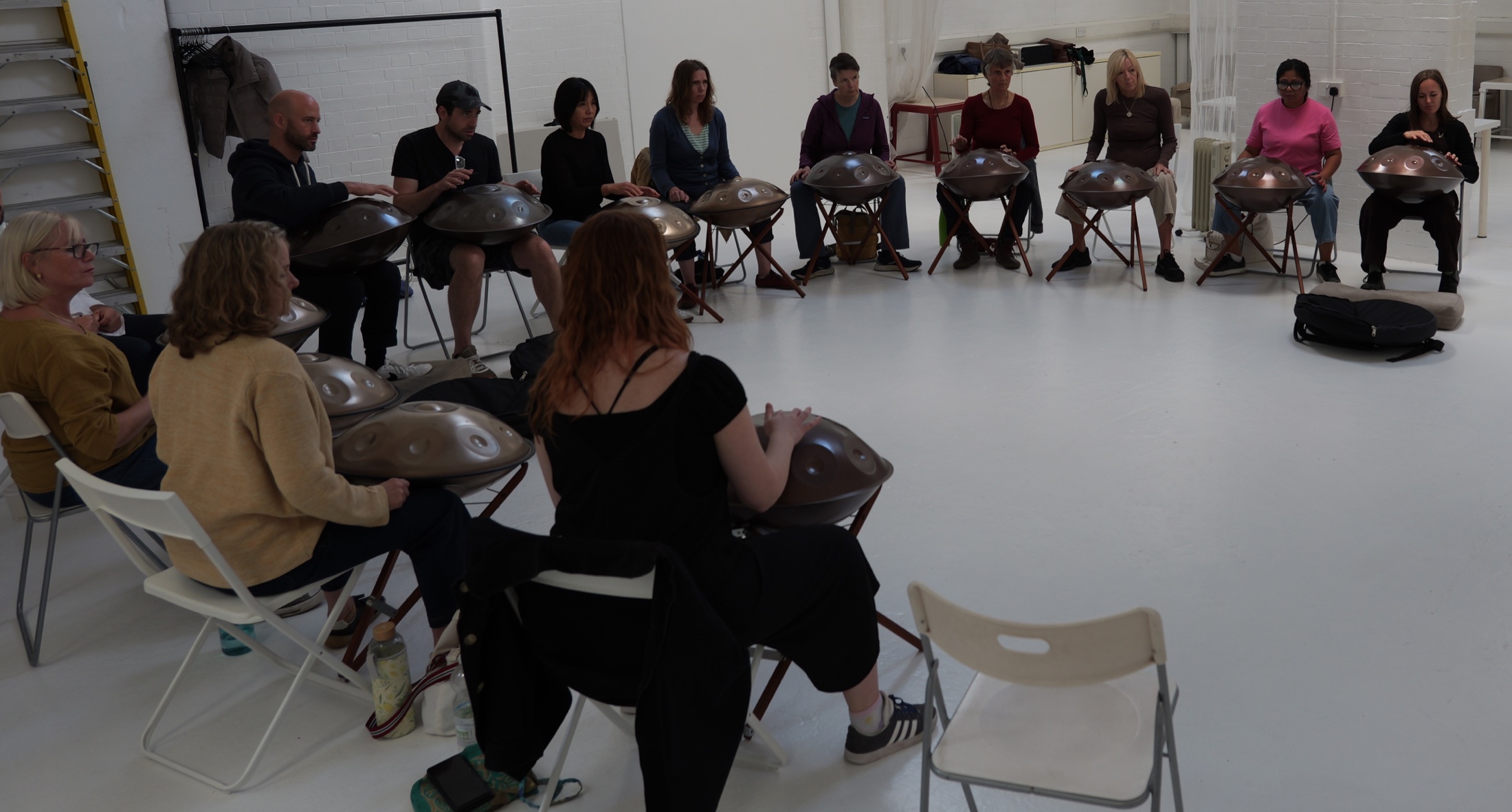 Group handpan lesson in a bright studio